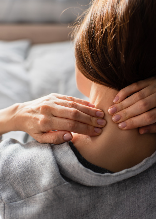 person massaging the neck experiencing tension relief and relaxation techniques for two areas of discomfort